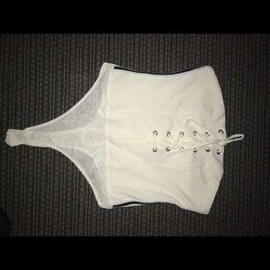 white strapless body suit with black lines on side